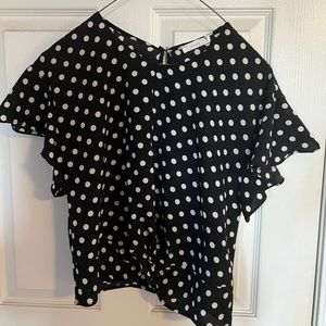 Black polka dotted Lush top with a knotted crop